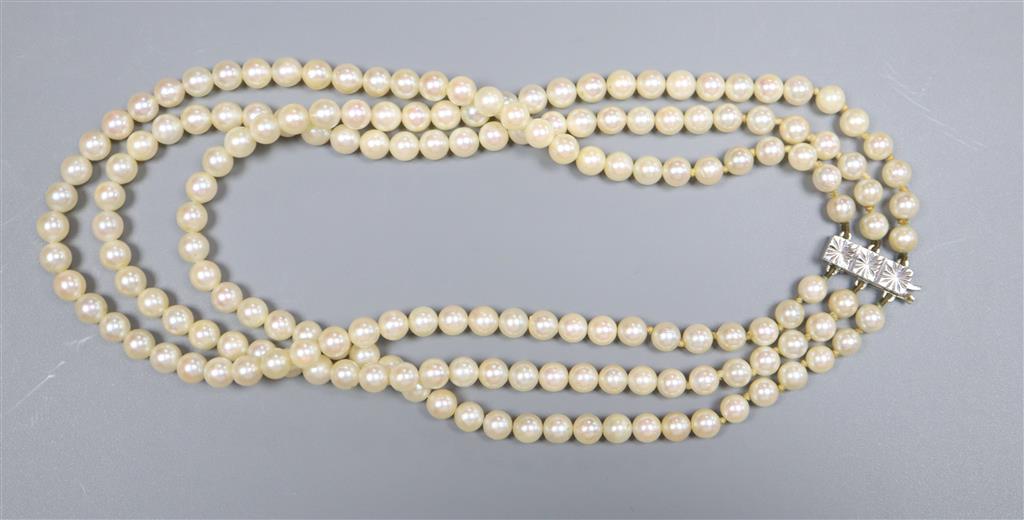 A modern triple strand cultured pearl choker necklace with 9ct white gold clasp, 35cm, gross 51.3 grams.